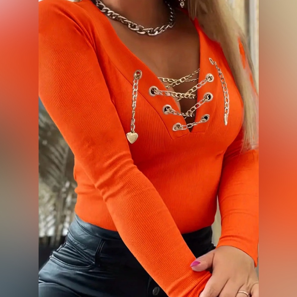 Elegant orange sweater with gold-tone chain accents. Lightweight, brand new.